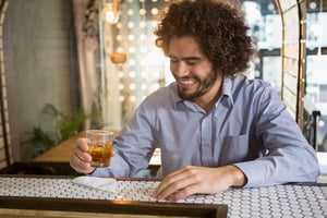 Man having glass of whisky in bar counter at bar-1