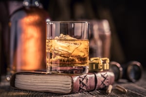tasty-cognac-with-journal-binocular-and-compass-2023-11-27-04-52-05-utc