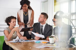 team of successful business people having a meeting in executive sunlit office-1